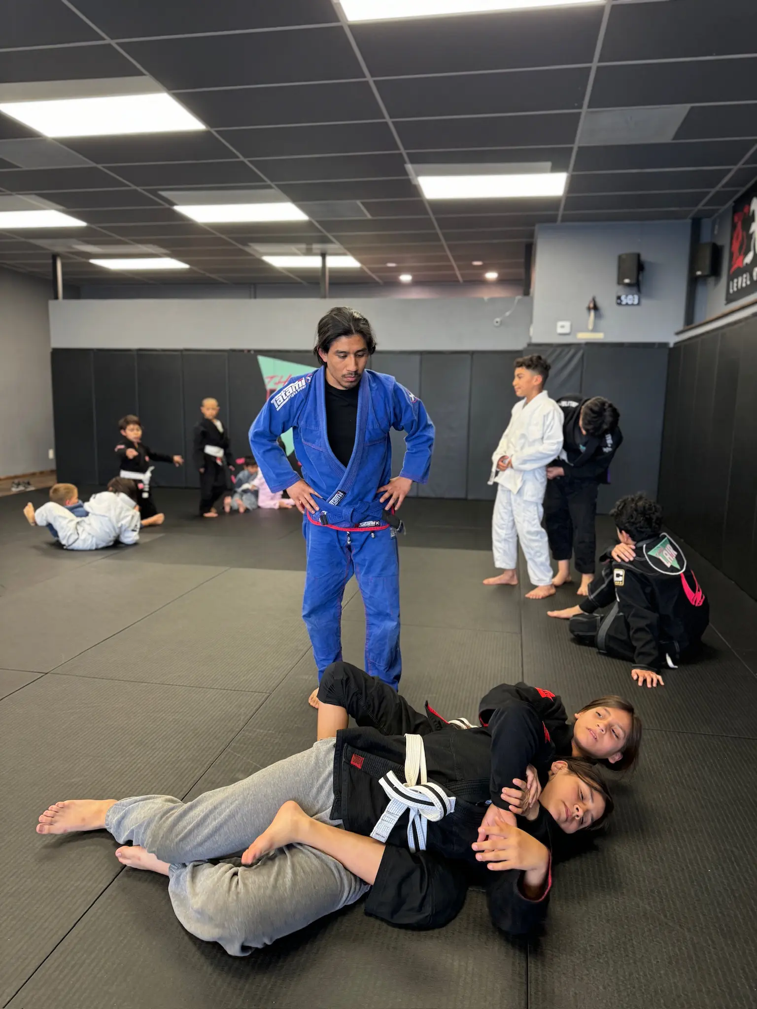 Happy teens in Glendora learning No Gi BJJ, improving balance, coordination, and having fun while building life skills.